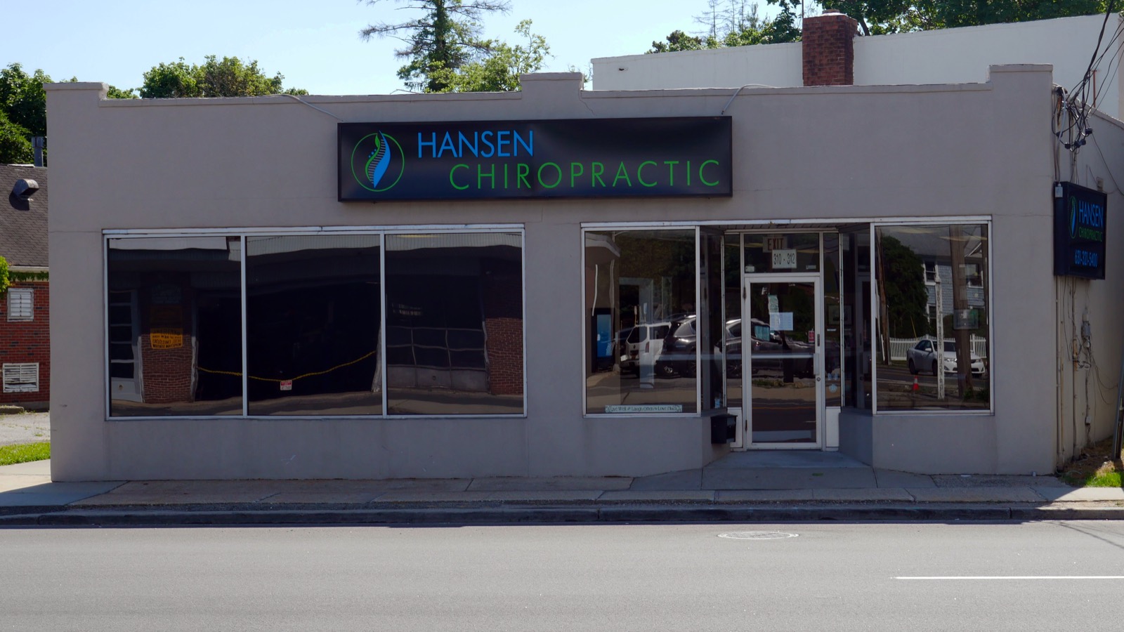 Front exterior of the Hansen Chiropractic office building at 310 Little East Neck Rd, West Babylon, NY, with the Hansen Chiropractic sign